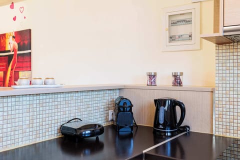 Compact Coffee Station with Kettle, Cups, and Essentials

