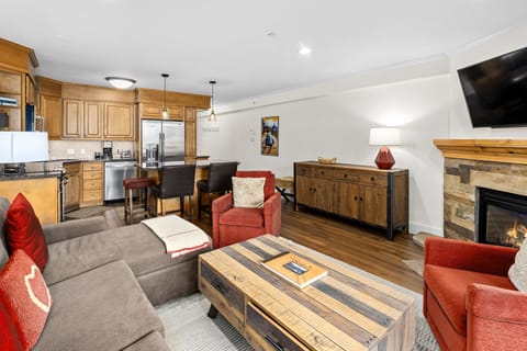 Cozy mountain retreat with stone fireplace, rustic charm & modern comfort. Open concept living perfect for relaxing after adventures. Fully equipped kitchen with stainless steel appliances and warm wood accents create the ideal home base.