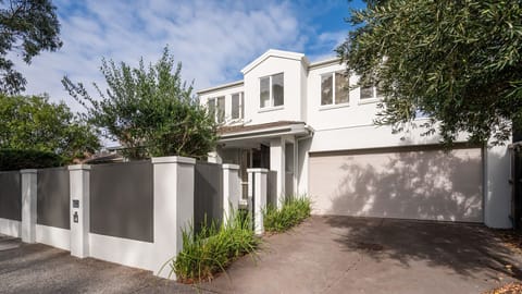 Stunning modern facade with double garage and secure front courtyard