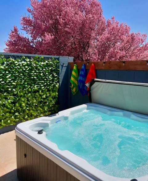 Spacious hot tub with full privacy, cozy vibes, and sunset views.