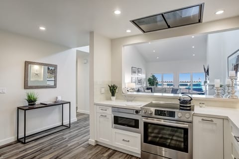 Kitchen invites guests to enjoy cooking while taking in the ocean views