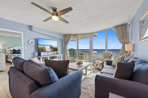 Relax in the bright, direct oceanfront living room with easy to your private beachfront balcony.