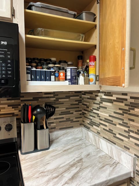 Spice cupboard with baking dishes