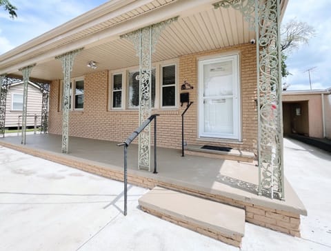 This charming brick home welcomes you with a spacious front porch! 
