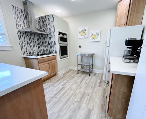 Fully stocked kitchen with full oven. stove, dishwasher, and refrigerator. 