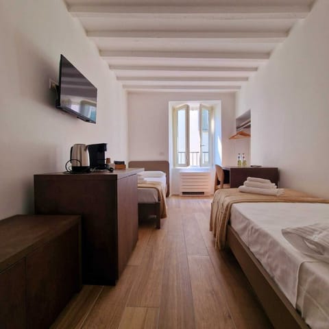 Comfort Twin Room | Minibar, in-room safe, iron/ironing board, travel crib