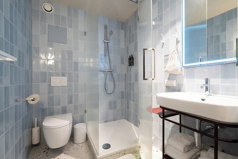 Eco-friendly toiletries, hair dryer, towels, soap