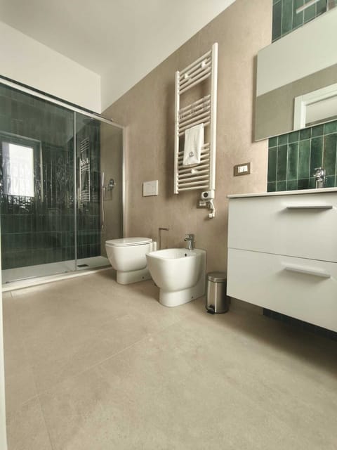 Luxury Triple Room, City View | Bathroom | Shower, rainfall showerhead, slippers, towels