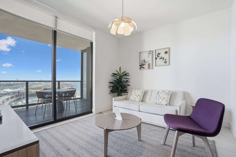 Step onto your private balcony and soak in panoramic city and ocean vistas