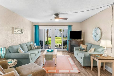 Cozy Living Room with Sleeper Sofa, Flat Screen TV and Private Patio Access