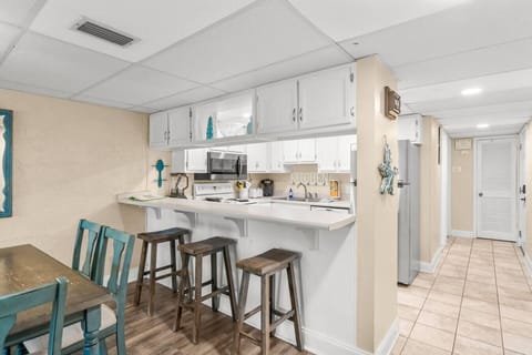 Fully Stocked Kitchen with Keurig Coffee Maker and Breakfast Bar Seating