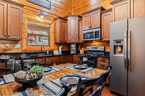 Open concept kitchen with dining table. Seats six comfortably