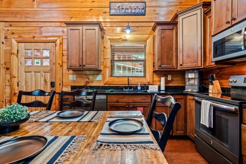 Open concept kitchen with dining table. Seats six comfortably. 