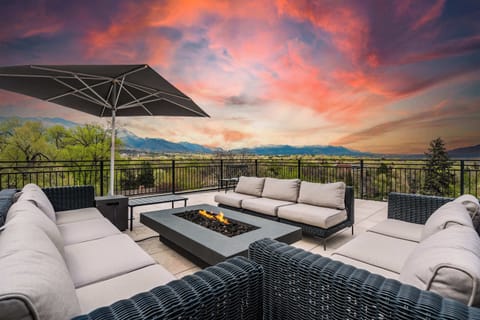 Welcome to The Overlook! Spacious rooftop patio with stunning mountain views, cozy seating, and a modern fire pit—perfect for enjoying Colorado sunsets.