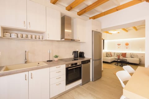 Cook your favorite meals in a modern full kitchen next to the comfy living room