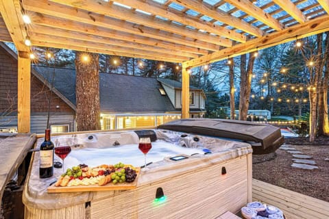 Unwind year-round in the luxurious hot tub nestled under a covered patio. Whether it's a cool evening or a rainy day, this private oasis offers the perfect place to soak, relax, and recharge in total comfort.
