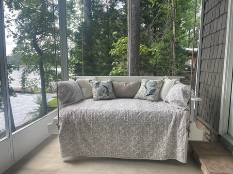 Twin-bed swing overlooking Lakeview underneath the screen section of the porch. 