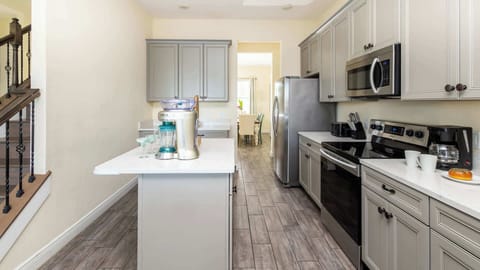 The open, airy kitchen offers ample space & all the comforts of home