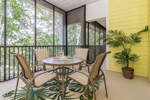 Screened HUGE balcony outside of bedroom 3 with outdoor seating