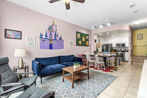 Cozy and spacious living area with, ceiling fan & smart TV