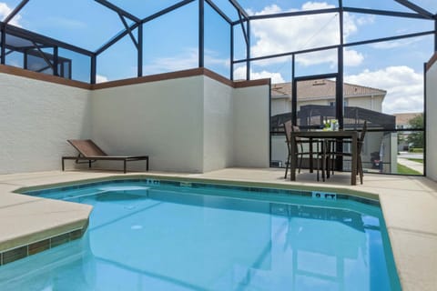 POOL HEATED! Screened in Pool with Seating for 4