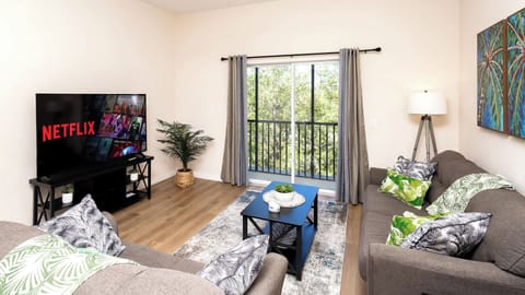 Curl up in the tropical living room & stream all your favorite entertainment