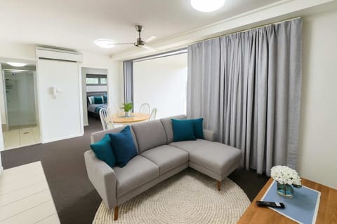 Living room with sofa, air conditioning and TV - Central Townsville