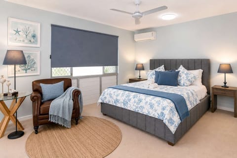 Bright Modern Bedroom with Comfortable Queen Bed & Soft Lighting
