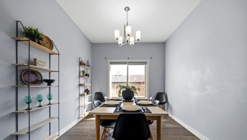 Enjoy the ease and simplicity of sharing a meal in this well-lit and functional dining area.