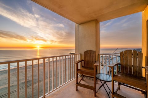 Wake up to breathtaking oceanfront sunrises and unwind with evening drinks on your private balcony overlooking the beach.