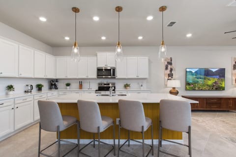 Expansive Full Size Kitchen with Bar Stool Seating