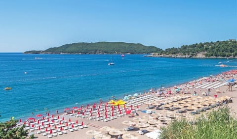 Beach nearby, white sand, sun loungers, beach umbrellas