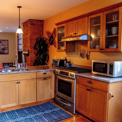 This open modern kitchen offers everything you could need for any size cooking project, from a thanksgiving meal to reheating leftovers.