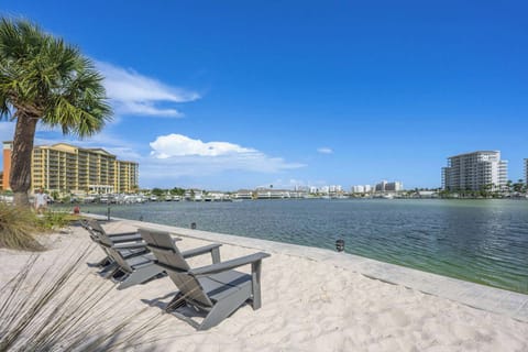 Scenic views of sand and sea with communal chairs for relaxing in style