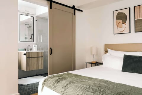 Bedroom 2 with king bed and en suite bathroom