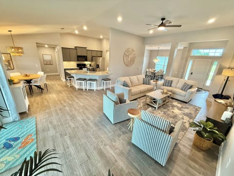 Family room, kitchen area & dining room offers easy cooking & conversation.