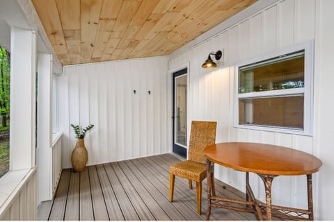 Sip coffee on the spacious deck surrounded by serene woodland views!