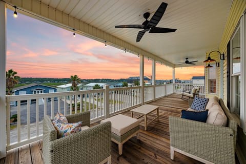 Lounge on the top floor balcony and watchvthe sunset over the marsh