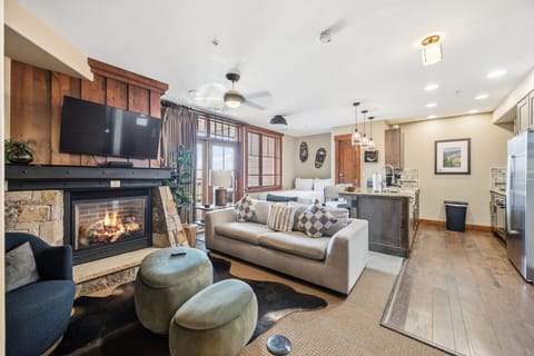 Open-Concept Mountain Living with Stone Fireplace
