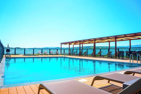 Outdoor pool, open 8:00 AM to 8:00 PM, free cabanas, pool umbrellas