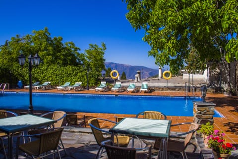 Seasonal outdoor pool, open 11:00 AM to 8:00 PM, sun loungers