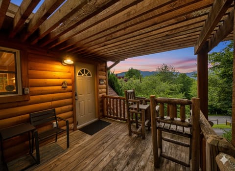 Porch Oasis: Savor breathtaking mountain views and relax on your rustic wooden deck!