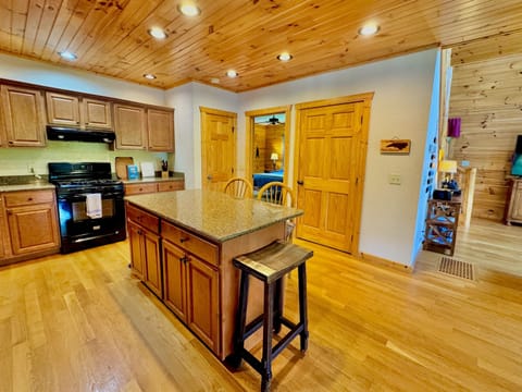 Gourmet Kitchen: Entertain with style in this stylish, well-equipped space featuring warm wood tones!