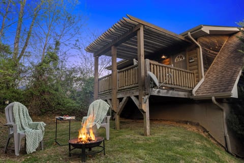 Outdoor Retreat: Gather around the fire pit and savor mountain views in this charming hideaway!