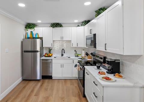 The full-size oven and stovetop, microwave, and large refrigerator make it easy to handle meals of any size, while the dishwasher ensures cleanup is a breeze.