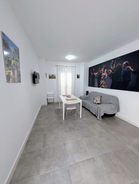 Comfort Apartment, Courtyard View | Living area | 32-inch Smart TV with digital channels, books, streaming services