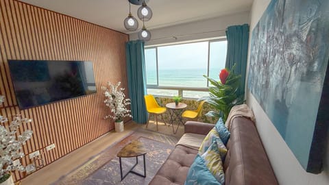 Comfort Apartment, 3 Bedrooms, Balcony, Beach View | Living area | Flat-screen TV