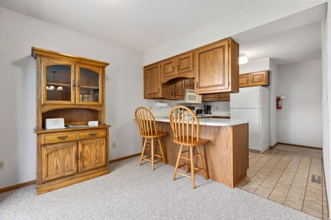 Functional kitchen with wooden cabinetry and ample counter space.