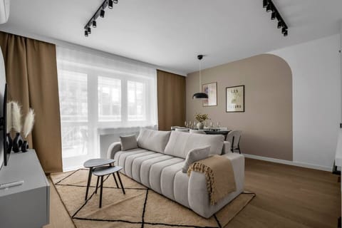 Living Room with Full Sofa Bed and Dining Area - Smart TV for your enterteinment | Book Now with RENTUJEMY.COM
