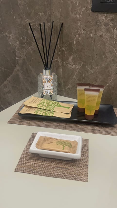 Deluxe Townhome | Bathroom | Shower, hair dryer, soap, shampoo